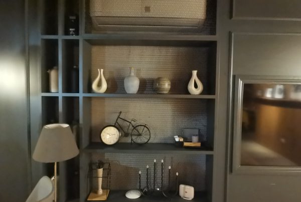 Functional and decorative metal mesh panels used as furniture in bar interior